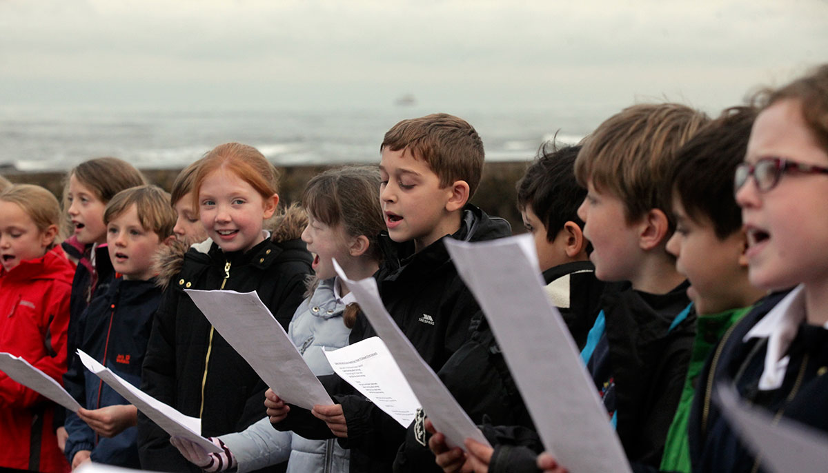 school children singing a sea shanty