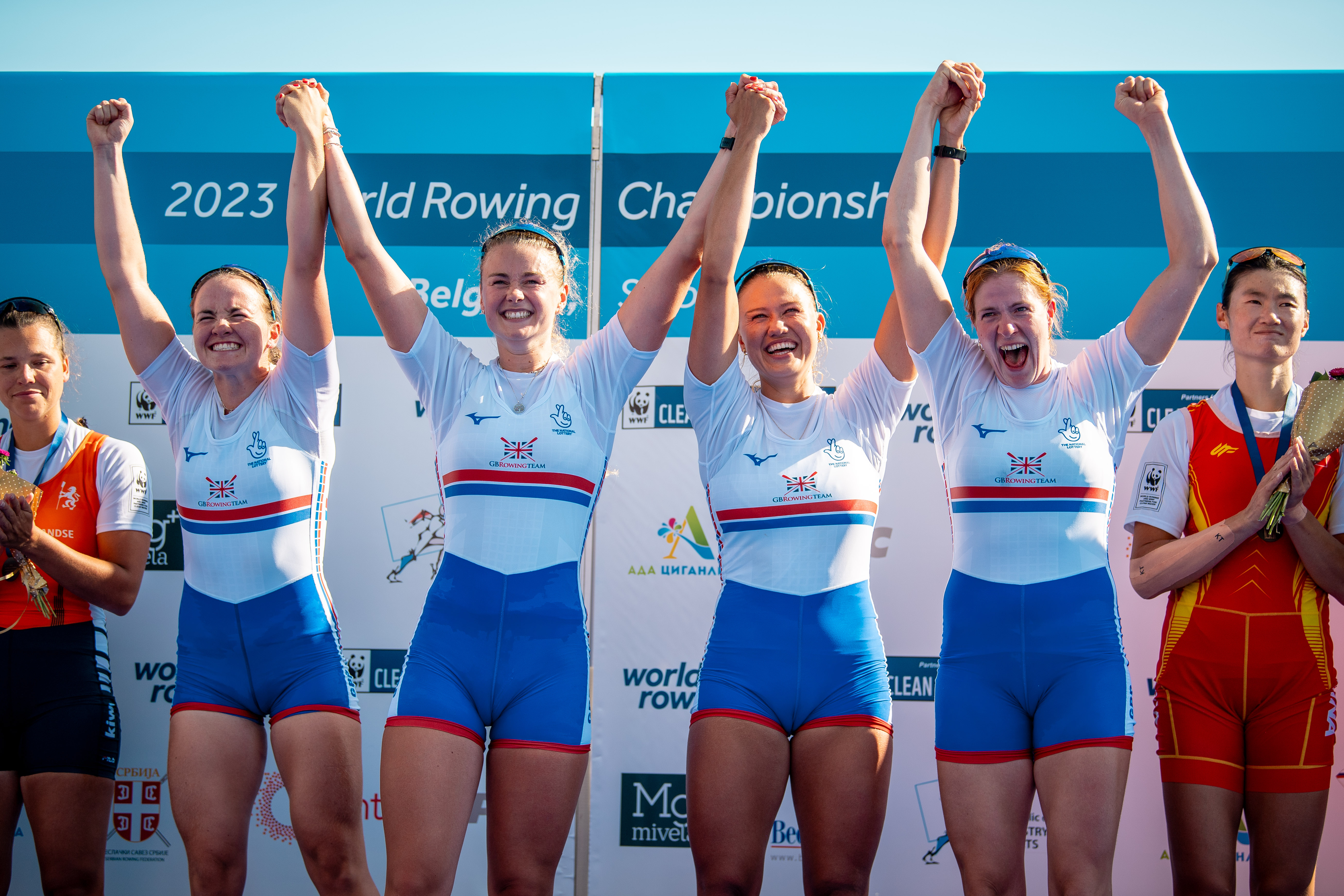 Rowing women quad celebrating gold