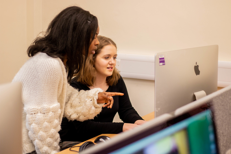 Student helping another student