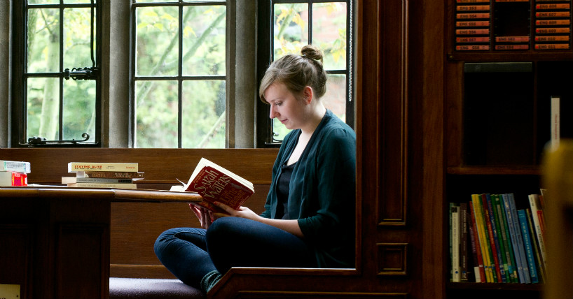 A student reading in the Language Center. A student reading in the Language Center.