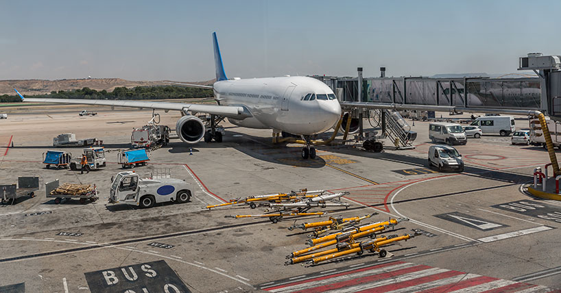 Commercial airplane parked on a runway