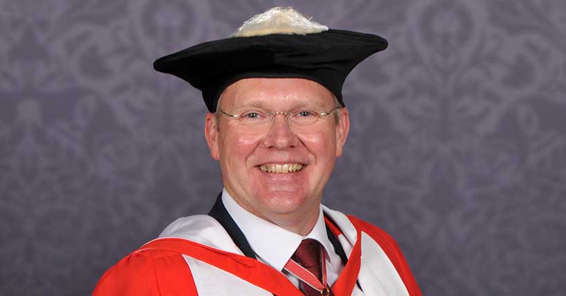 A photograph of Nick Forbes in his robes for his honorary degree