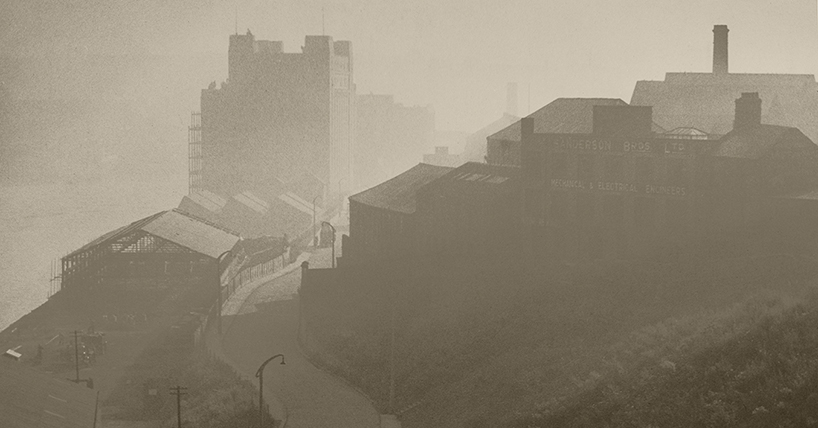 A sepia photo showing the Flour Mill, Gateshead now the Baltic art gallery on the Tyne river surrounded by mist