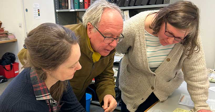 Song Detectorists at work Prof. Kirsten Gibson and Dr Steph Carter with Matthew Banister exploring the Henry Atkinson book at Northumberland Archives. Image by Natalie Steed, Rhubarb Rhubarb.