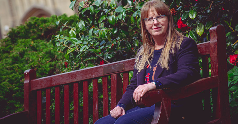 Professor Lidija Siller sitting on a bench on Newcastle University's campus