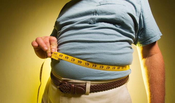 Man measuring his waist