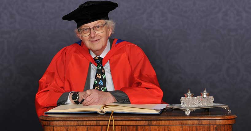 A photograph of professor Sir Martyn Poliakoff receiving an honorary degree