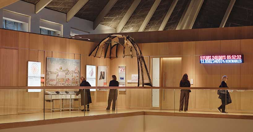 A photograph of a mycelium arch in place at the Design Museum in London. 