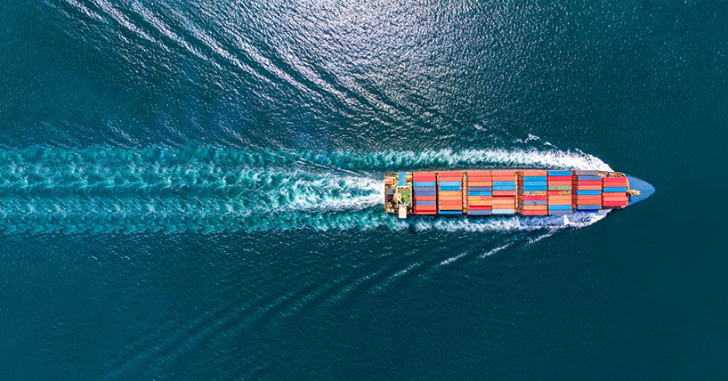 Aerial top view of cargo ship