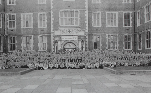 Over 100 students positioned in front of the Students