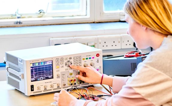 A student taking part in practical learning as part of their education