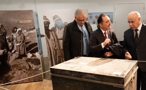 Three visitors from Iraq explore the Gertrude Bell exhibition in the Great North Museum Hancock.