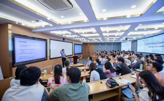 Dr Jose Liu addresses a lecture hall at the Tri-Annual Conrerence 2023