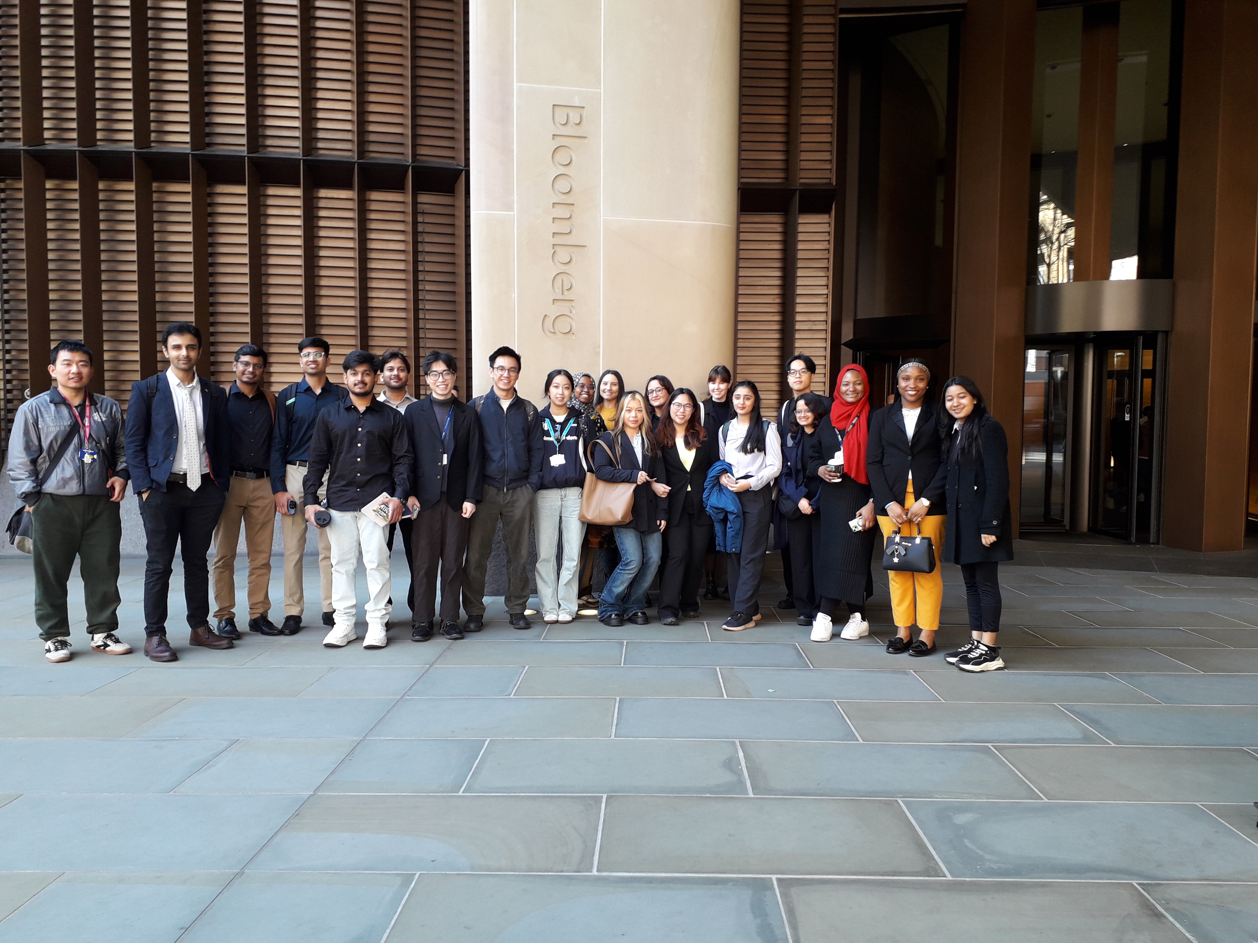 Group photo taken outside of Bloomberg