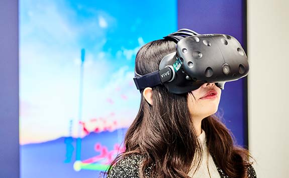 A woman wearing a virtual reality headset.