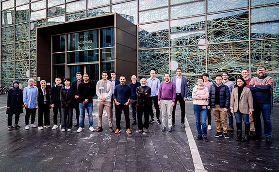 A group photo of our AMBER research team outside of the Urban Sciences Building on our Newcastle University campus.