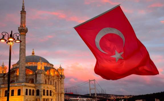 mosque with a waving Turkish flag