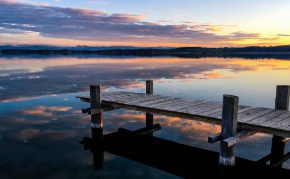 pier on a lake at sunset