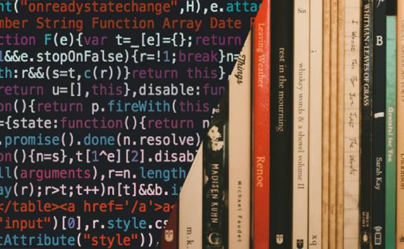half of the image showing computer code and half of the image - books on a bookshelf