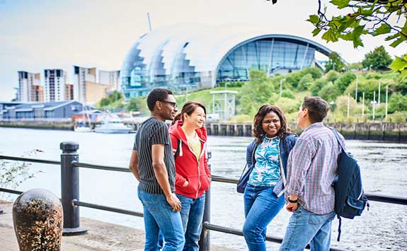 students interacting along the quayside, Newcastle.