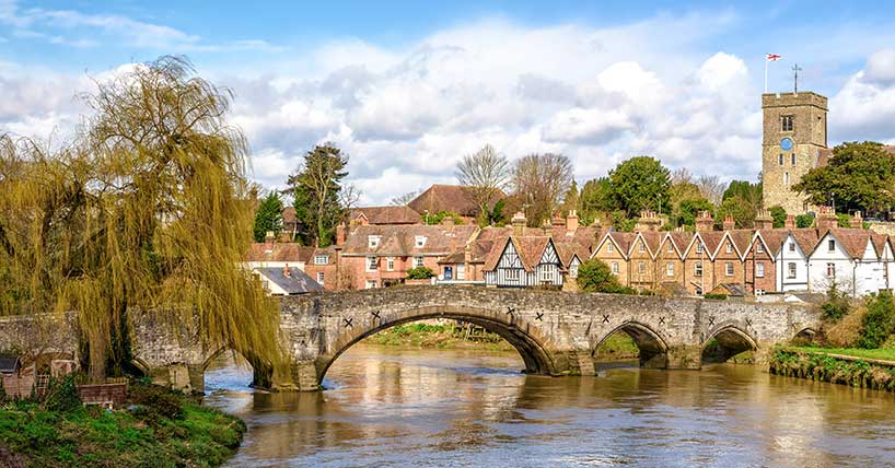 An English hamlet with medieval bridge and church.