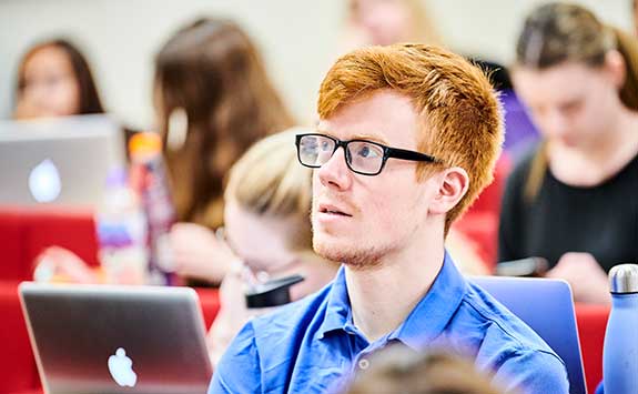 A law student listens during a lecture.