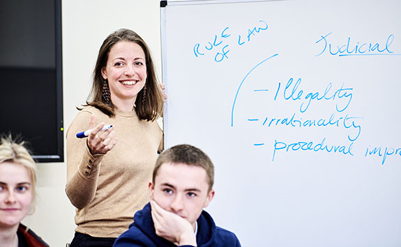 Instructor and two students in a Law seminar