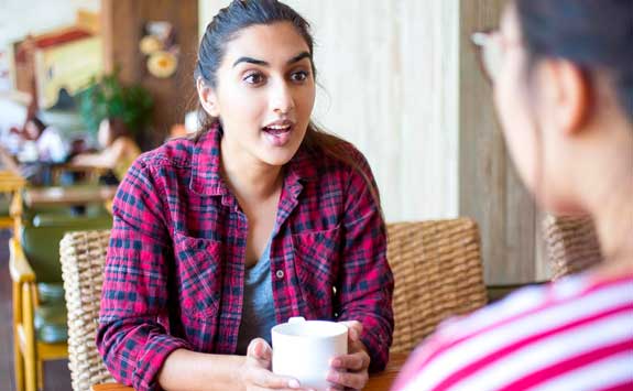 Students talking with coffee