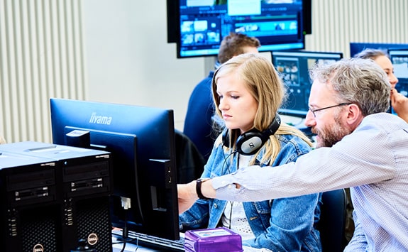 Students gathered around computer