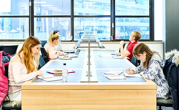 Students working inside the University.