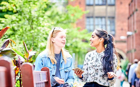 Students talking on campus.