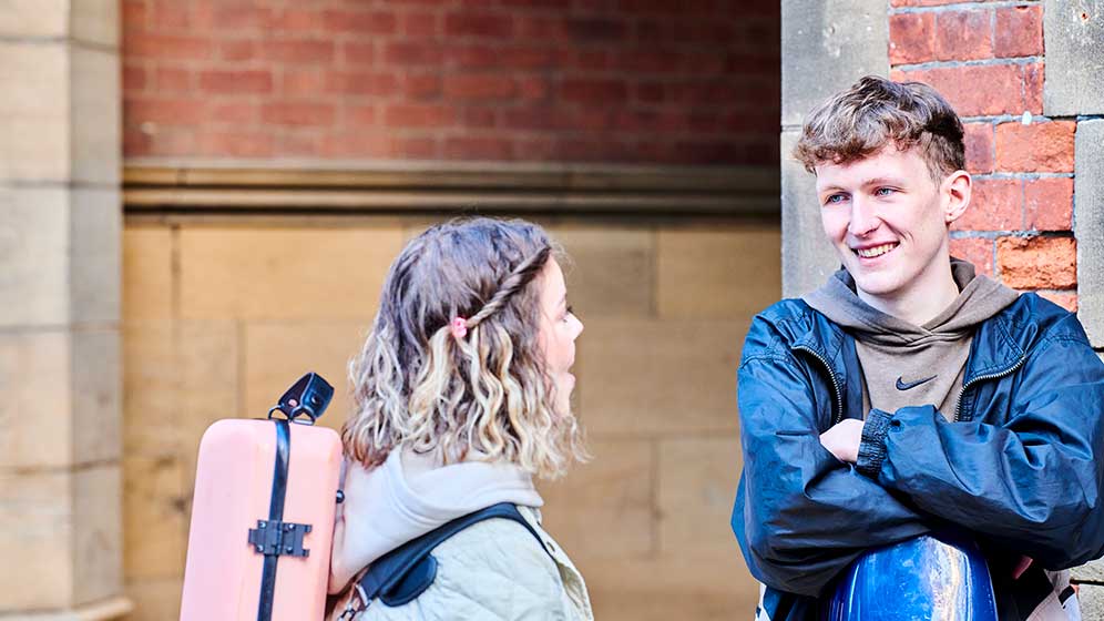Music students chatting on campus