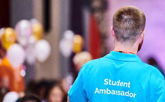 Image shows the back of a student ambassador