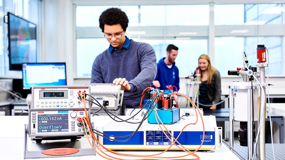 An engineering student setting up an experiment.