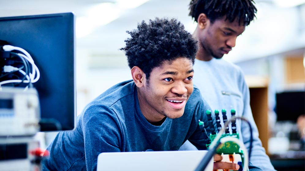 A student with a mechanical hand