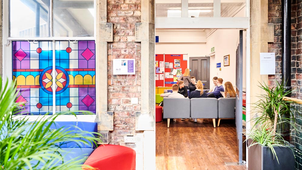 Students in a common area at the Newcastle University Law School