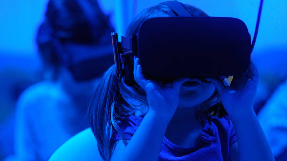 Child wearing VR headset.