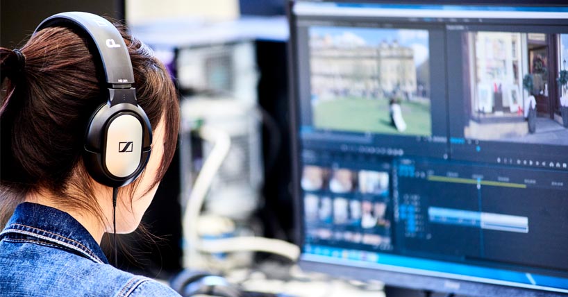 Student editing video footage as part of multimedia package