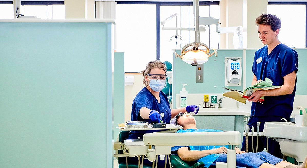 A student smiles while working