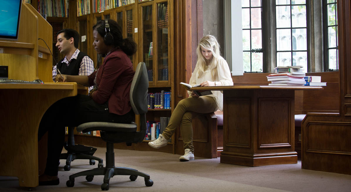 A student reading in the Old Library Building