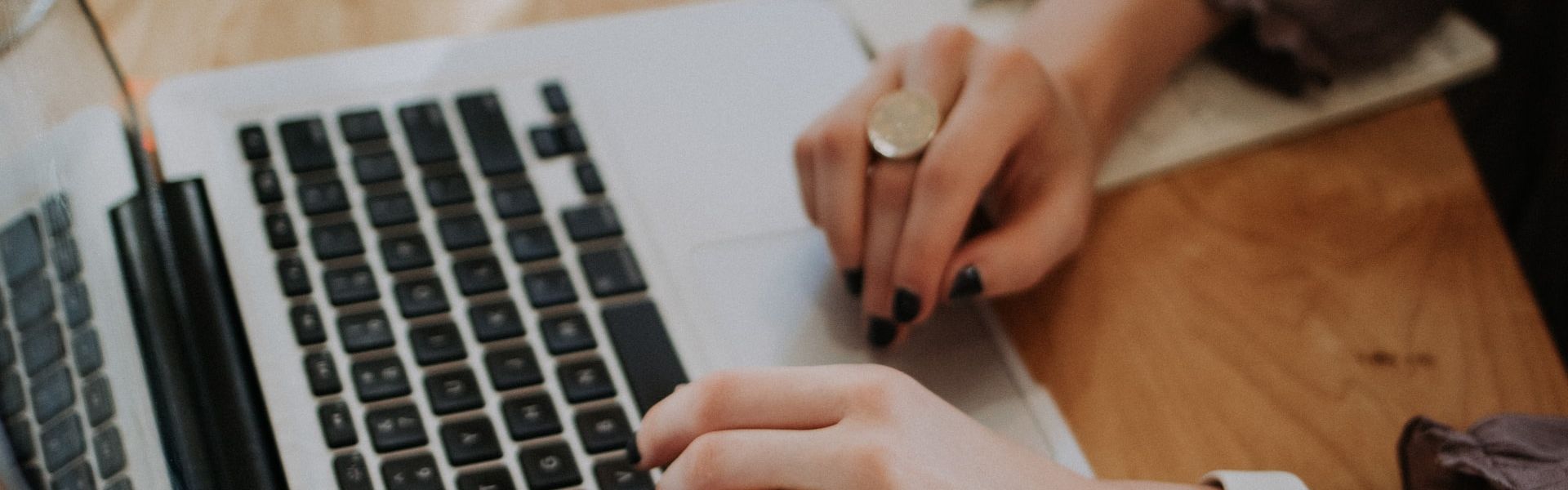 Woman typing on a keyboard.