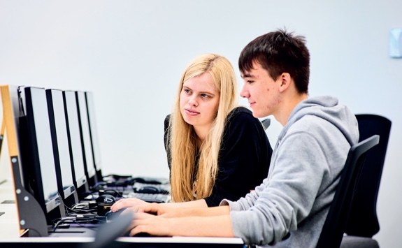 2 Students sitting at a laptop