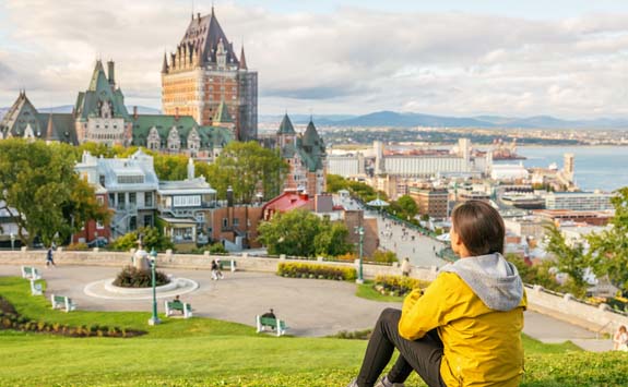 Student enjoying view of Chateau Frontenac castle in Canada.