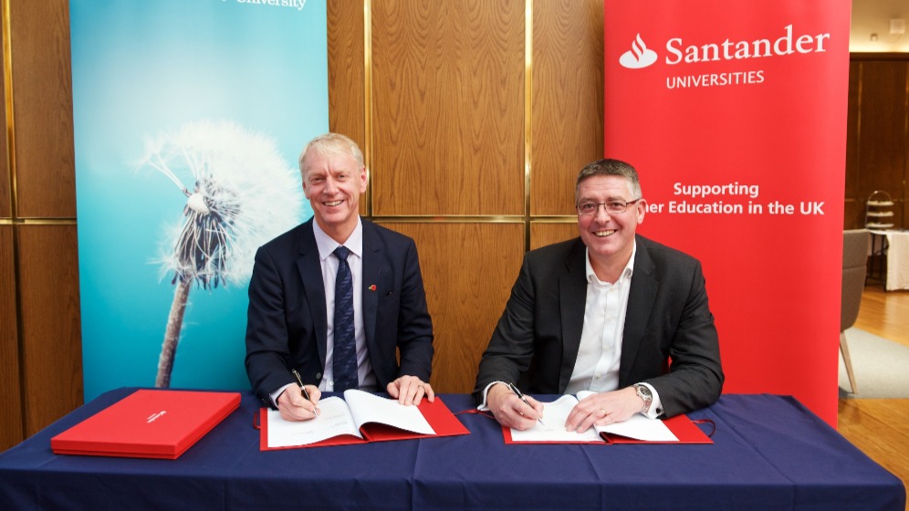 Newcastle University Vice Chancellor sitting at a table next to another man