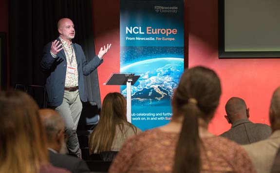 A speaker at Newcastle University, NCL Europe hub